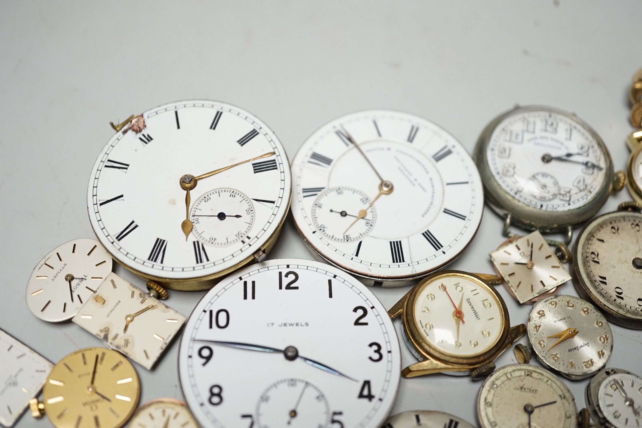 A collection of assorted wrist and pocket watch parts.